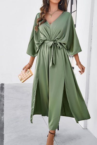 Slit Tied V-Neck Three-Quarter Sleeve DressFeatures: Tied, Slit
Sheer: Opaque
Stretch: Slightly stretchy
Body: Not lined
Material composition: 100% polyester
Care instructions: Machine wash cold. Tumble dry lDresses-Quarter Sleeve Dress