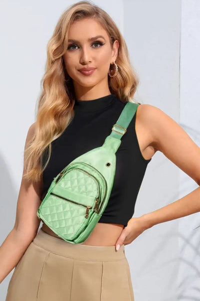 Fame Multi-Layer Zipper Crossbody Bag worn by a model with a black top and beige skirt, showcasing its stylish and practical design.