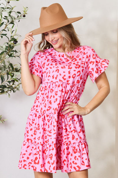 Double Take Short Flounce Sleeve Tiered DressThis short flounce sleeve dress features a round neck and a tiered design, creating a playful and boho-chic look. The tiered design add movement and dimension to theDressesShort Flounce Sleeve Tiered Dress