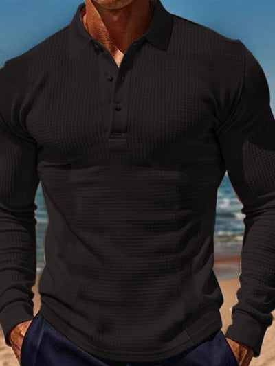 Men's full size black waffle-knit quarter button polo shirt with long sleeves and stretchy polyester fabric
