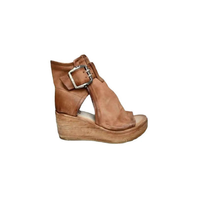 Peep toe wedge sandals with a mid heel and buckle design.