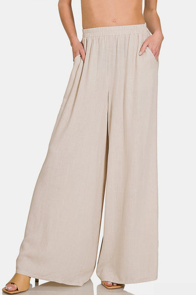 Zenana Pleated Linen Blend Wide Leg Pants in beige with pockets, featuring elegant pleats and a comfortable wide-leg silhouette.