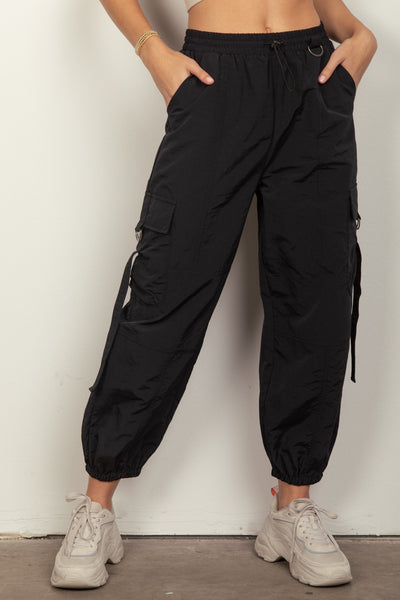 VERY J Elastic Waist Woven Cargo PantsStay on-trend with these Y2K-inspired elastic waist solid woven cargo pants featuring a utility design perfect for everyday wear. The side pockets and D rings add a PantsElastic Waist Woven Cargo Pants