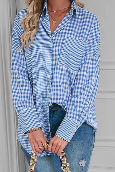 Pocketed plaid collared neck long sleeve shirt in blue and white.