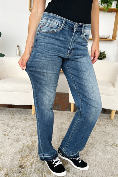 Judy Blue Full Size Mid Rise Release Hem Jeans with pocket detail and moderate stretch.