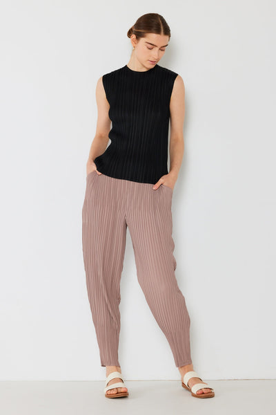 Marina West Swim pleated relaxed-fit slight drop crotch jogger in taupe, worn by a model in a sleeveless black top.