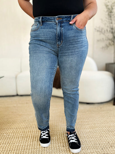 Judy Blue mid rise jeans with magic release hem, moderate stretch, and classic structured look.