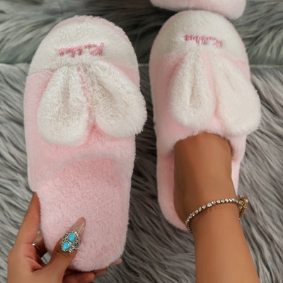 Pink Rabbit Ears Round Toe Slippers on feet, featuring plush material and flat heels.