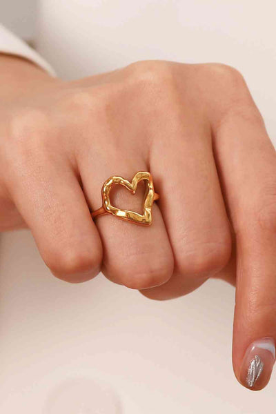 18K gold plated heart-shaped ring on finger, fashion style.