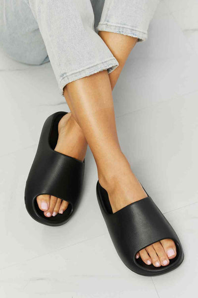 NOOK JOI In My Comfort Zone Slides in BlackThis slide features a durable rubber sole that provides excellent grip and traction on any surface, ensuring that you stay steady on your feet no matter where you goComfort Zone Slides