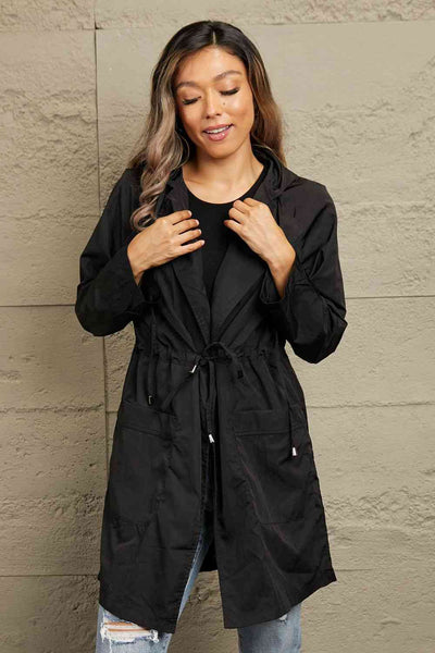 Double Take Drawstring Hooded Longline JacketSizing category: Regular
Picture style: Studio
Pattern type: Solid
Style: Chic, casual
Features: Drawstring, pockets
Neckline: Hooded
Length: Long
Sleeve length: ThrOuterwearDrawstring Hooded Longline Jacket